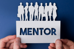 cutouts of people in paper with the word mentor below