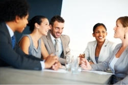 A group of colleagues around a conference table