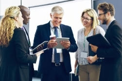 A group of people discussing information