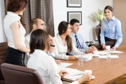 A team of people sitting at a conference table